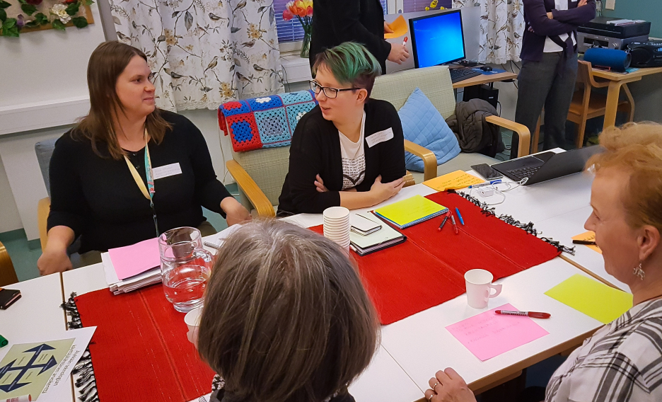 Group of people discussing at a table